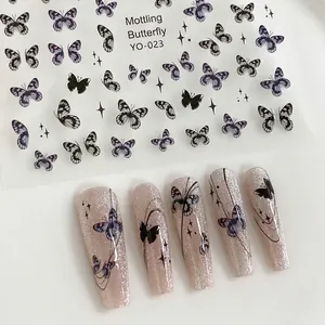 Detail view of YO-023 nail stickers featuring purple butterflies and star elements