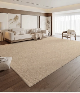 Detailed weave texture of large modern beige jute living room area carpet on wood floor