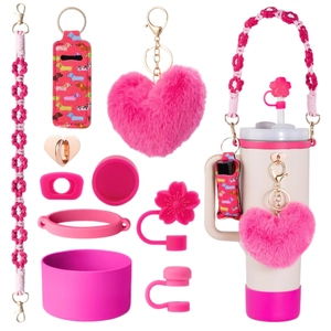 Pink tumbler accessories set featuring woven flower strap, plush heart and dog lip balm holder
