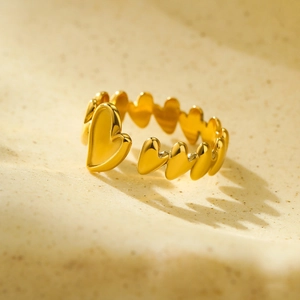 Close-up of gold 18k plated irregular heart linked ring with adjustable open design