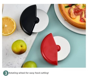 Detail of red and black pizza cutters with ergonomic handles and stainless steel blades