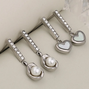 Silver drop earrings with white pearl and heart shell pendants featuring clear rhinestones