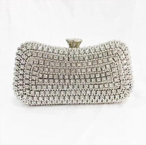 Macro detail of rectangle clutch bag with shimmering silver rhinestones and crystal clasp