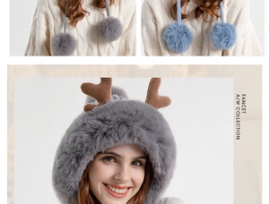 Detail of plush grey earflap hat with decorative antlers and soft faux fur pom-poms