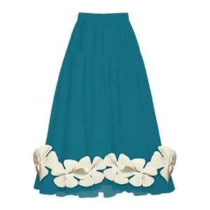 Detail view of teal tiered skirt with 3D white floral appliqués along the hemline