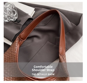 Detail shot of woven texture on brown shoulder bag with smooth strap for women