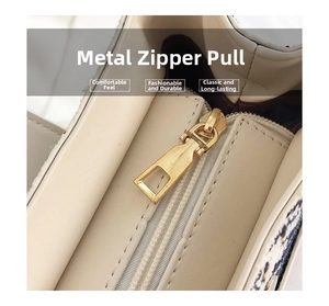 Macro detail of high-quality golden hardware zipper on a textured bucket bag