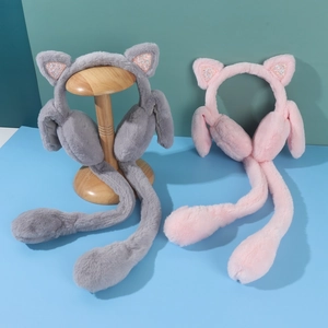 Detail view of plush cat ear earmuffs in grey and pink with sequined inserts and long paws