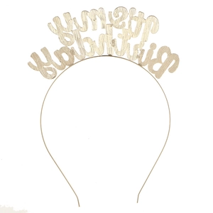 Close-up of gold metal headband featuring cutout IT'S MY BIRTHDAY lettering detail