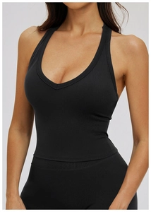Close-up of black V-neck yoga tank top with hollow back detail and breathable stretch fabric