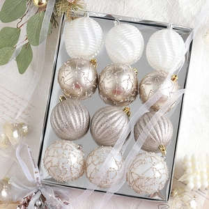 Champagne and white Christmas ball set with glitter and pearls in a silver mirror tray
