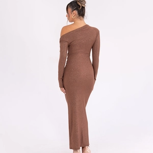 Detail of glitter brown one-shoulder maxi dress showing back view and slim fit texture
