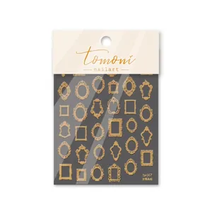 Macro detail of rose gold vintage ornate frame nail art stickers in brand packaging