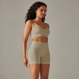 Detail of seamless knit yoga set featuring a V-neck sports bra and high-waist shorts