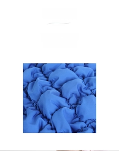 Macro shot of high-quality blue nylon fabric with soft bubble texture and smooth stitching