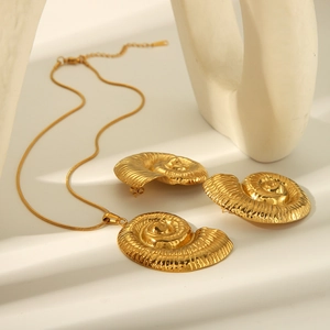 18K gold plated stainless steel seashell necklace and earring set on minimalist props