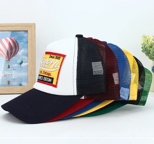 Classic Western embroidered trucker hat with mesh back and vintage adventure patches