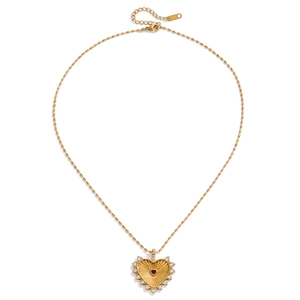 Detail of 18K gold stainless steel necklace with red heart pendant and small crystals