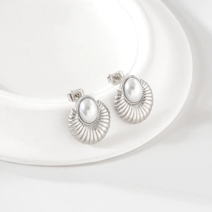 Elegant silver fan-shaped earrings with oval pearl inlay on a white pedestal