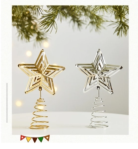 Close-up of hollow metal Christmas tree star toppers in gold and silver finish