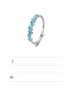 Macro detail of S925 sterling silver ring featuring marquise turquoise stone clusters