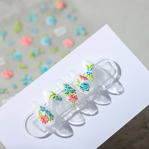 3D embossed nail stickers featuring red and blue floral patterns with green leaves on nails