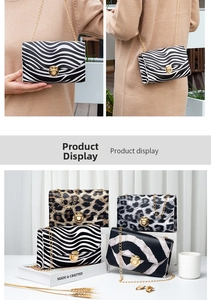 Detail of animal print mini bags with gold ring locks and metallic chain straps