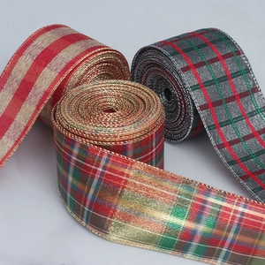 Macro shot of plaid Christmas ribbons with metallic wire edges and woven texture