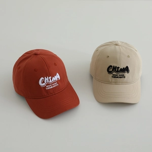 Close-up of cotton baseball caps with 3D embroidery showing premium canvas texture
