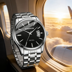 Close-up of silver stainless steel watch on a plane window with sunset clouds