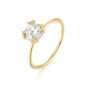 Macro view of gold S925 sterling silver ring featuring a round brilliant-cut stone