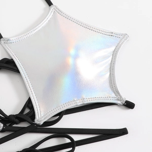 Macro detail of laser silver star bikini top with holographic finish and black ties