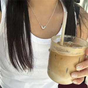 Minimalist 925 sterling silver V-shape necklace worn on collarbone in a lifestyle setting