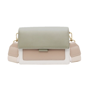 Chic color-block square crossbody bag in sage green and white with wide woven strap