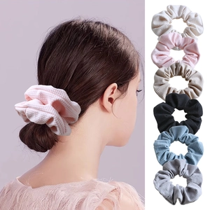 French retro waffle fabric scrunchie set in six diverse colors worn on model and stacked