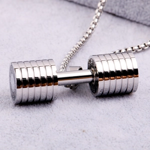 Close-up of silver titanium steel dumbbell pendant necklace on grey plush background