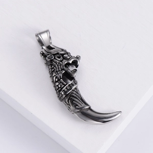 Retro titanium steel dragon fang pendant with intricate dragon head carving and vintage finish