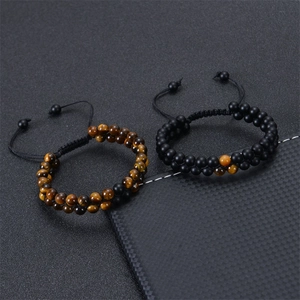 Detailed view of adjustable double-layer tiger eye and matte stone beaded bracelets set