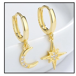 Macro shot of 18k gold plated S925 silver hoop earrings with moon and star zircon charms
