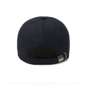 Detail view of winter baseball cap back with metal buckle and elastic strap