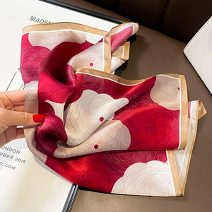 Elegant mulberry silk square scarf with red floral pattern and golden rolled edges