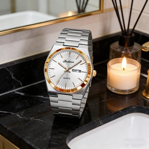 Elegant men's watch detail with dual calendar display on high-end marble background