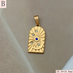 Detailed view of arch-shaped gold heart evil eye pendant with blue zircon 10.4x18.8mm