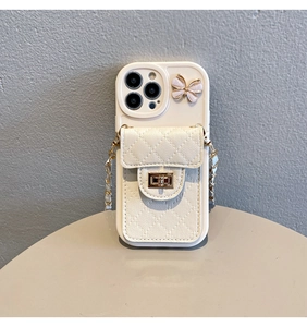 Close-up of beige iPhone case with quilted butterfly wallet and gold chain strap