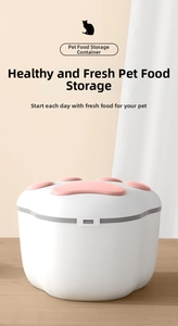 Close-up of white pet food container with pink paw lid on wooden surface for freshness