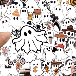 Close-up of a hand holding a cute bat-winged ghost sticker from the Halloween collection