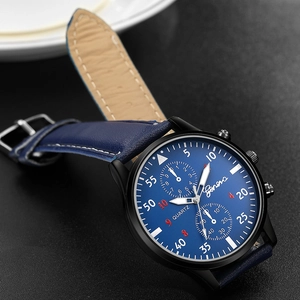 Detailed close-up of Geneva men's business watch with navy blue leather strap and black case