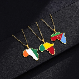 Detailed macro of gold-plated Africa map necklaces with vibrant national flag enamel colors