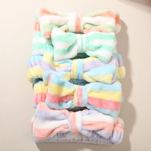 Five-pack of soft microfiber facial headbands with colorful macaron stripes and bows