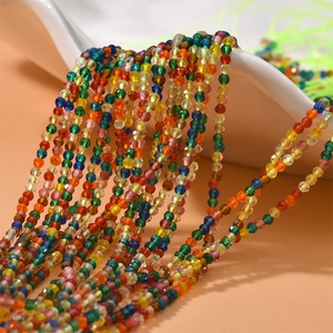 Macro view of 2mm faceted colorful crystal beads flowing for DIY jewelry making